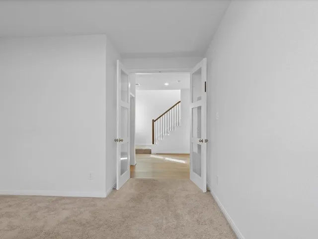 a view of a hallway with an empty room
