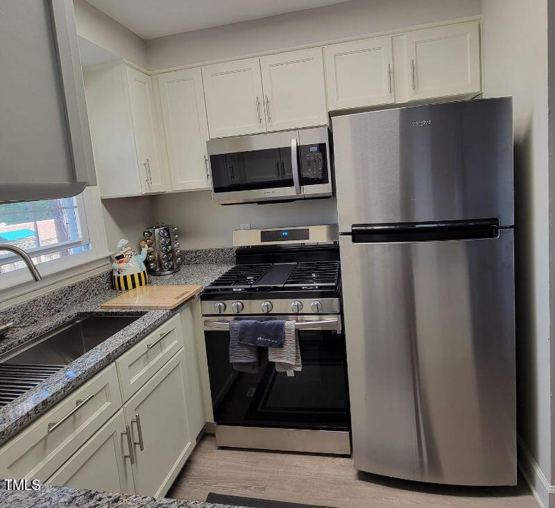 141 Jones Franklin Road, Unit E Raleigh, NC 27606 - Photo 5 of 20 328771_1_36194007-full