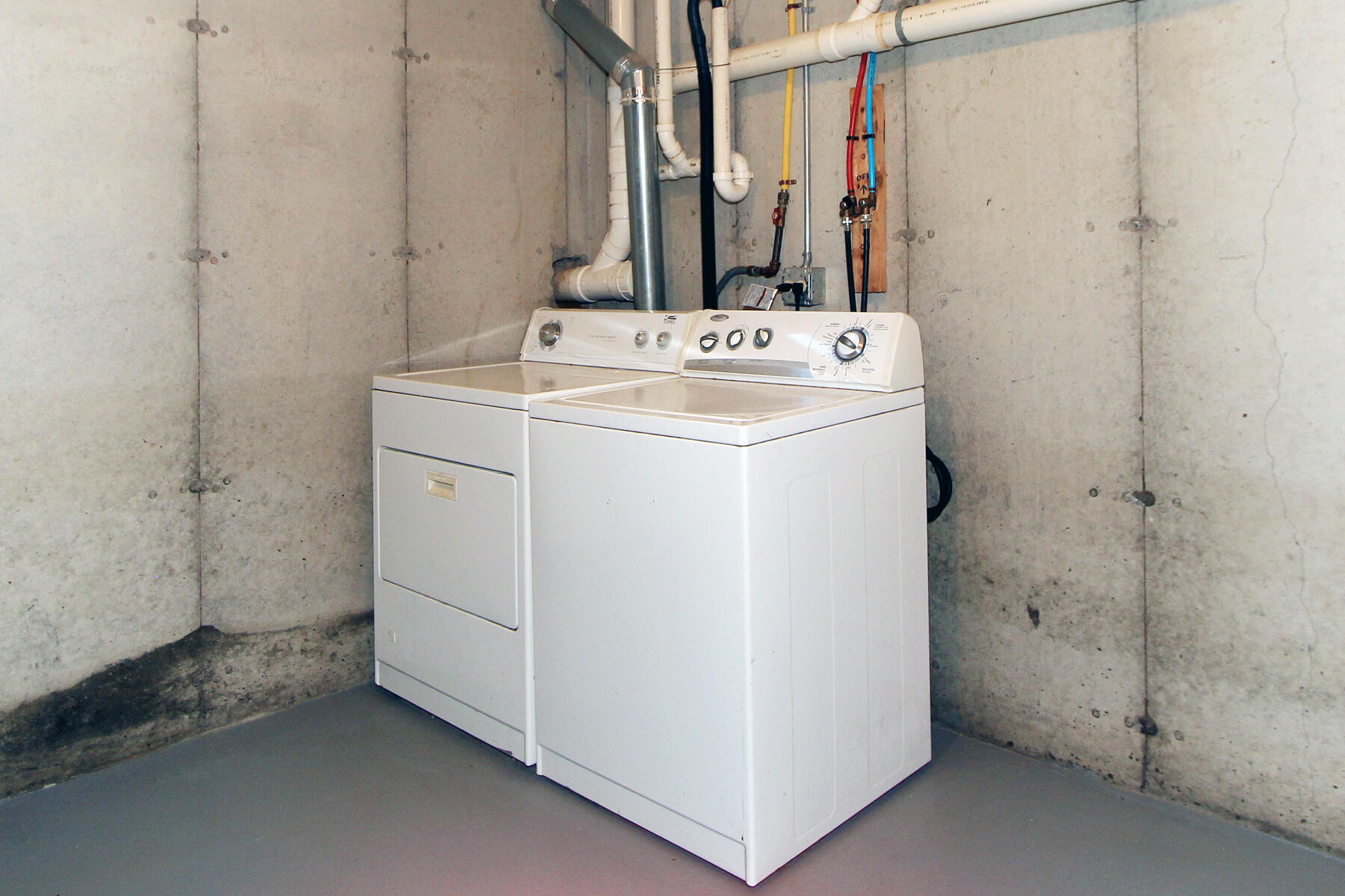 495 Aspinet Road Eastham, MA 02642 - Photo 26 of 47 a utility room with a washer dryer and a view of living room