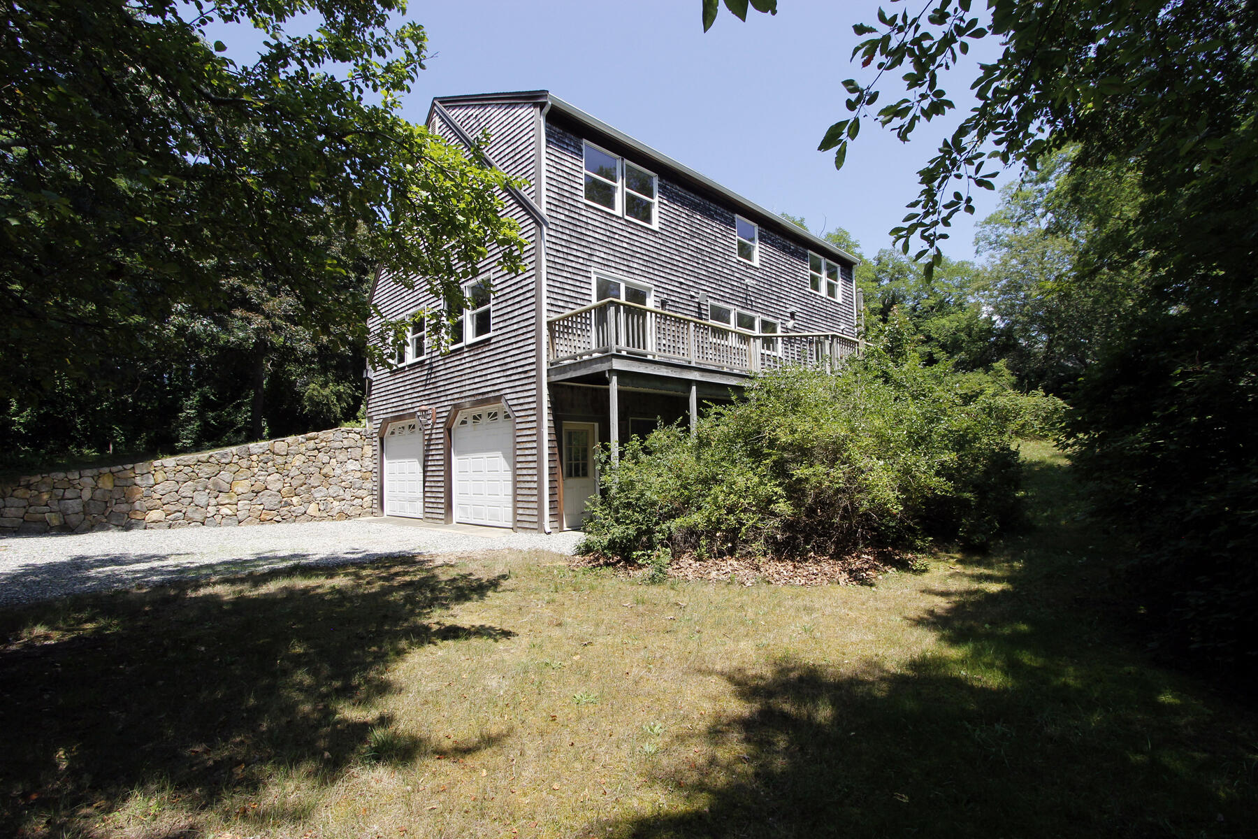495 Aspinet Road Eastham, MA 02642 - Photo 34 of 47 a front view of a house with a yard