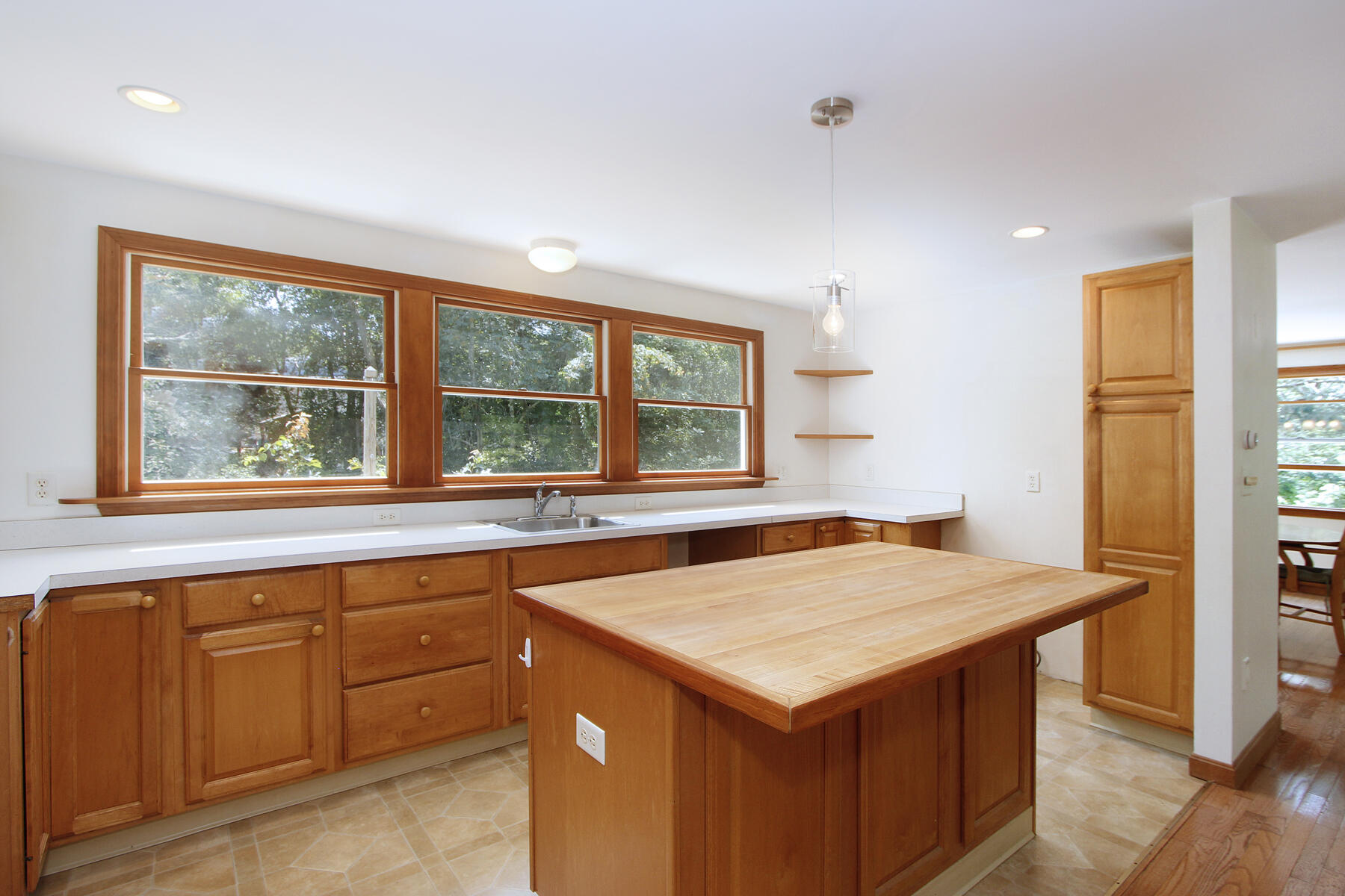 495 Aspinet Road Eastham, MA 02642 - Photo 9 of 47 a kitchen that has a sink and a table in it