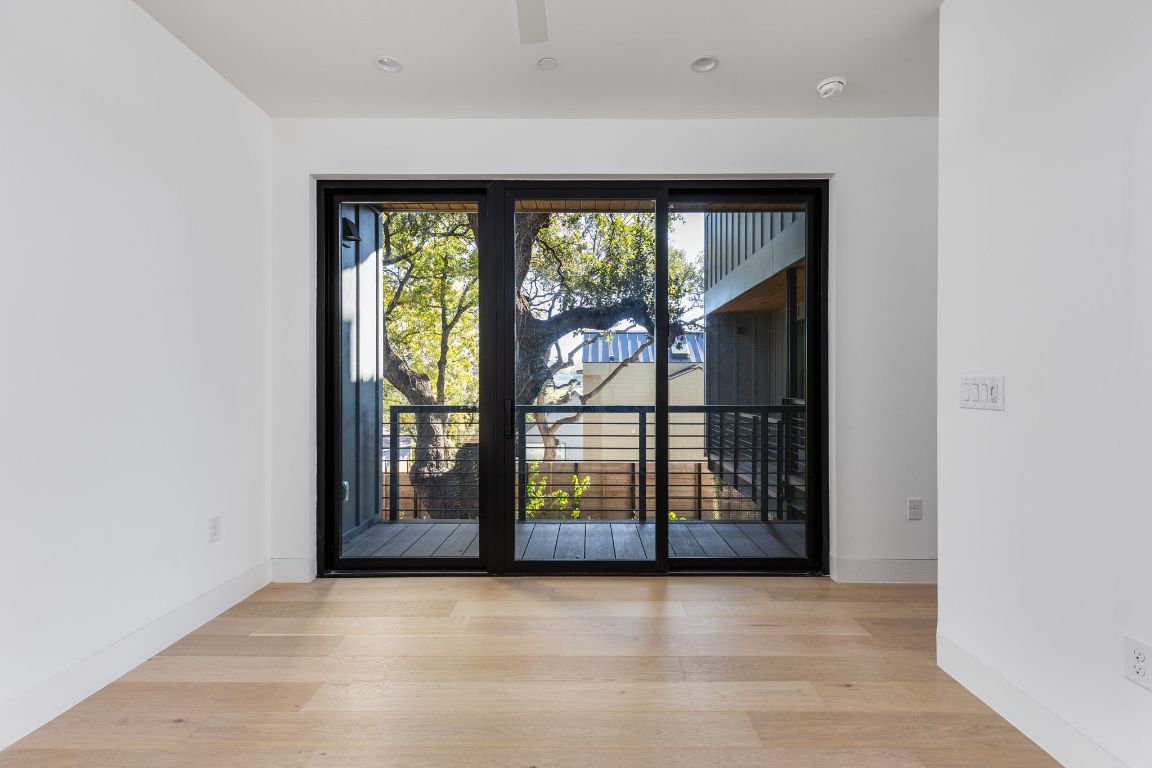 1603 Chelsea Lane, Unit 1 Austin, TX 78704 - Photo 15 of 40 Spare room with light wood-style floors and baseboards
