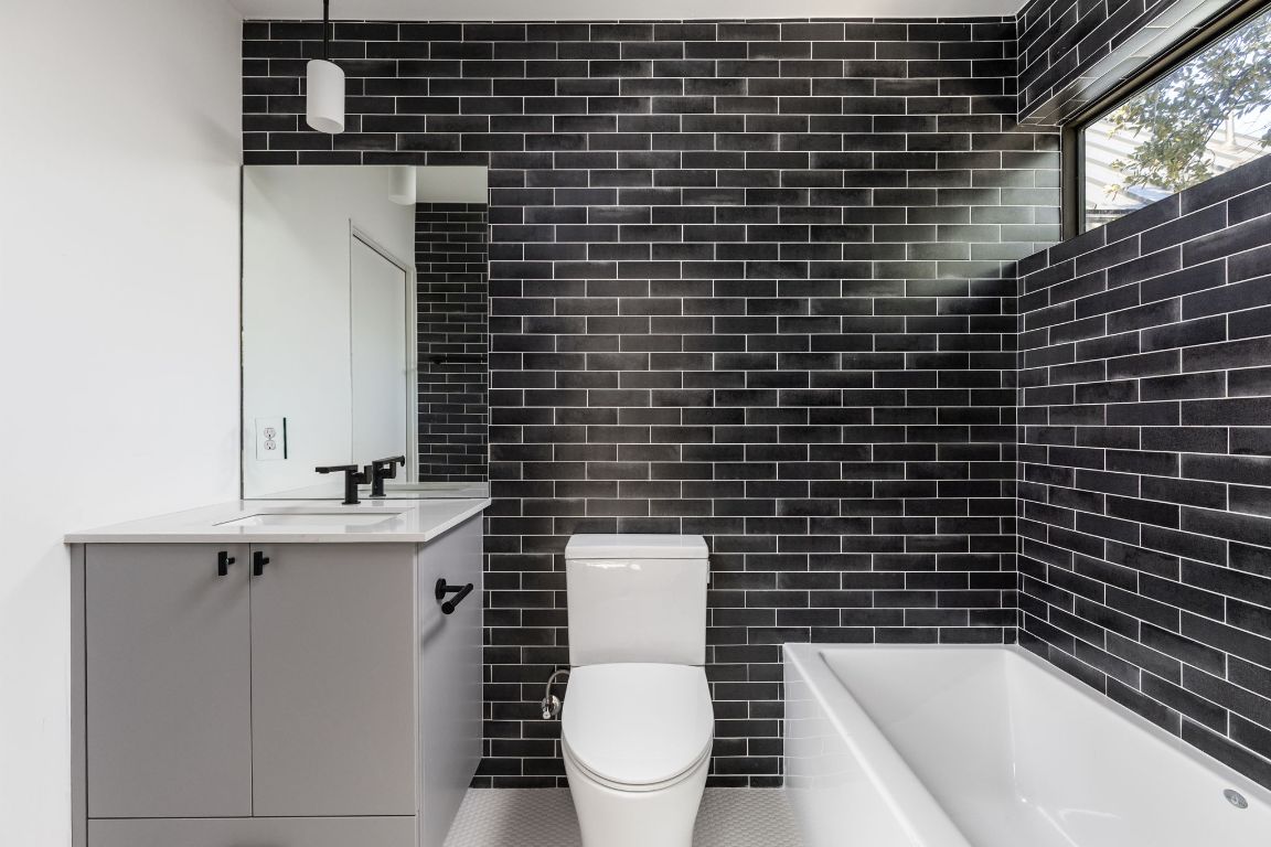 1603 Chelsea Lane, Unit 1 Austin, TX 78704 - Photo 29 of 40 Full bath featuring vanity and toilet