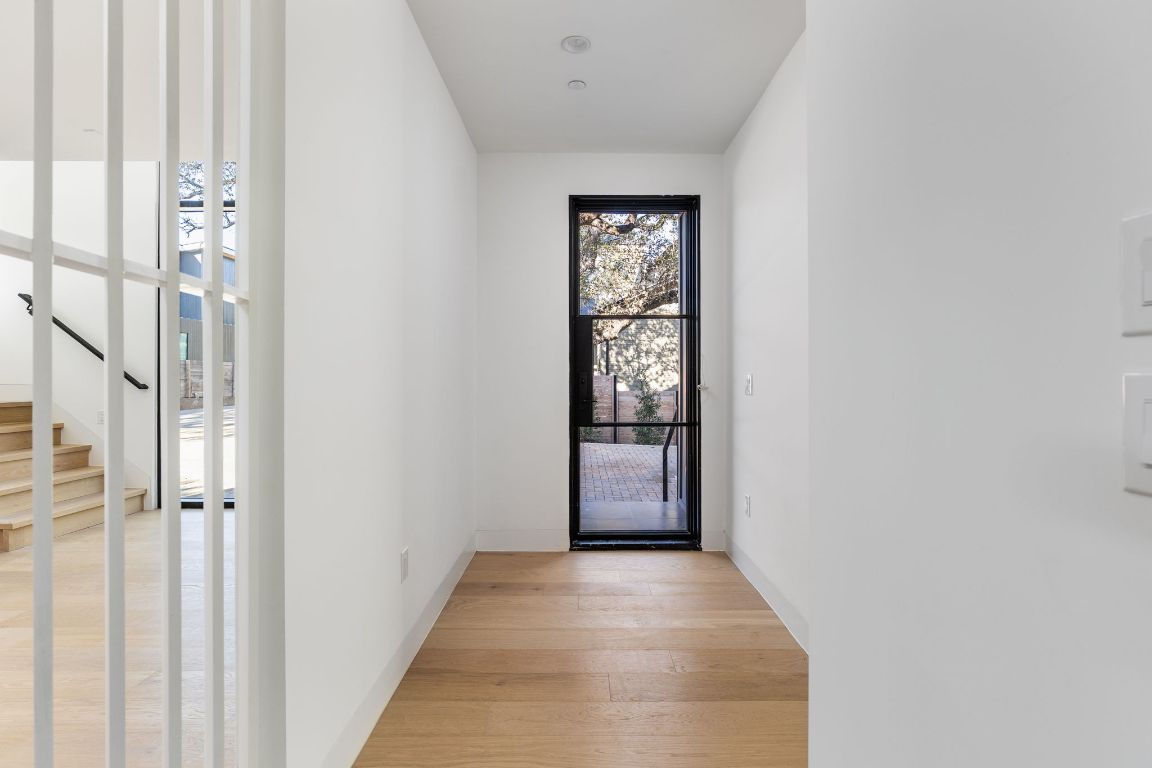 1603 Chelsea Lane, Unit 1 Austin, TX 78704 - Photo 4 of 40 Entryway with stairs and hardwood / wood-style flooring