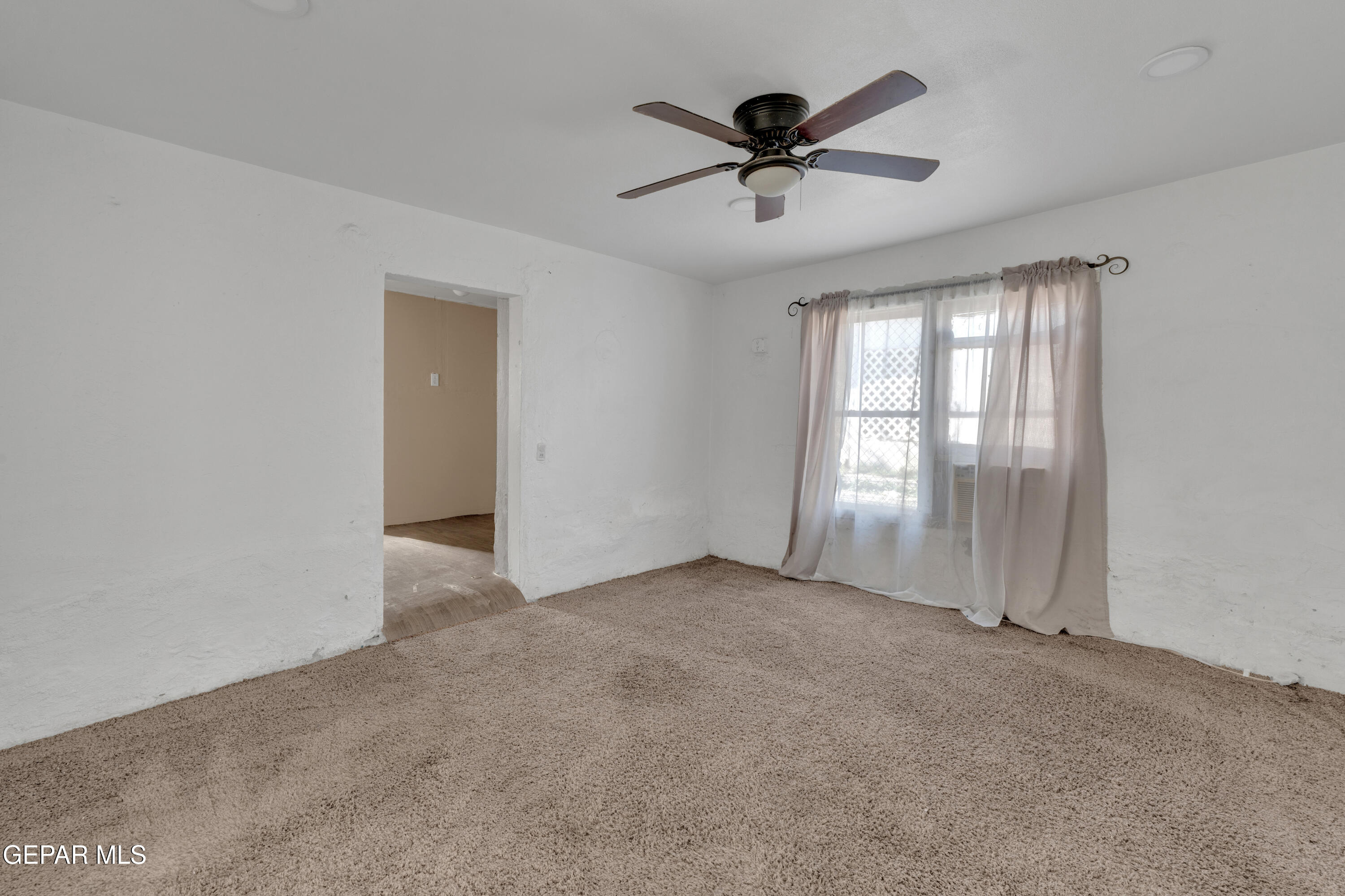 10184 Haynes Road Socorro, TX 79927 - Photo 18 of 25 a view of an empty room with a window