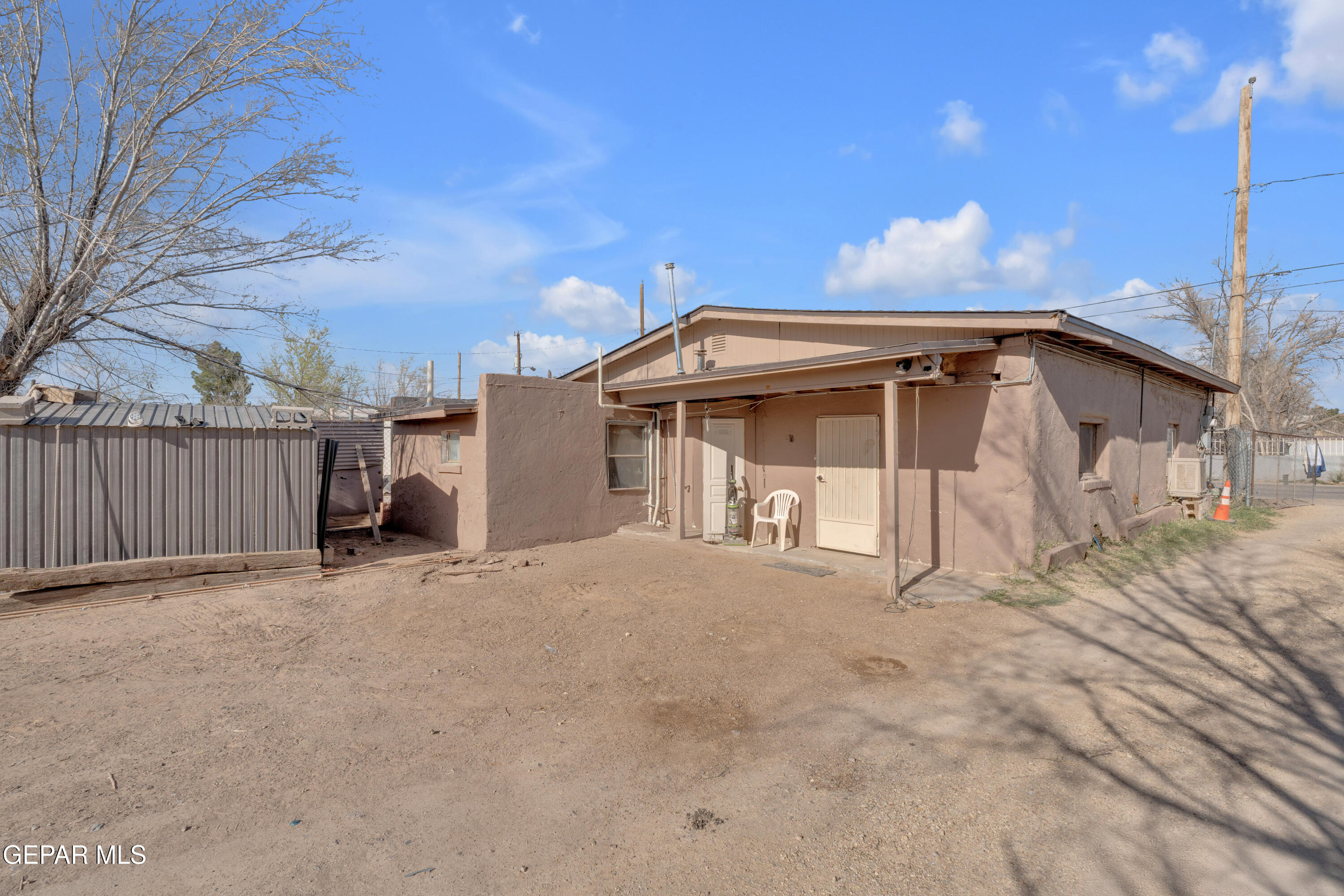 10184 Haynes Road Socorro, TX 79927 - Photo 23 of 25 a view of a house with a small yard and wooden fence