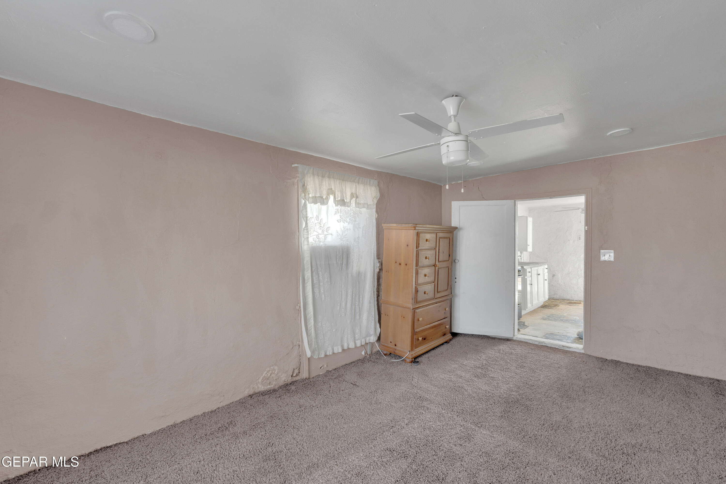 10184 Haynes Road Socorro, TX 79927 - Photo 8 of 25 an empty room with fan and entryway