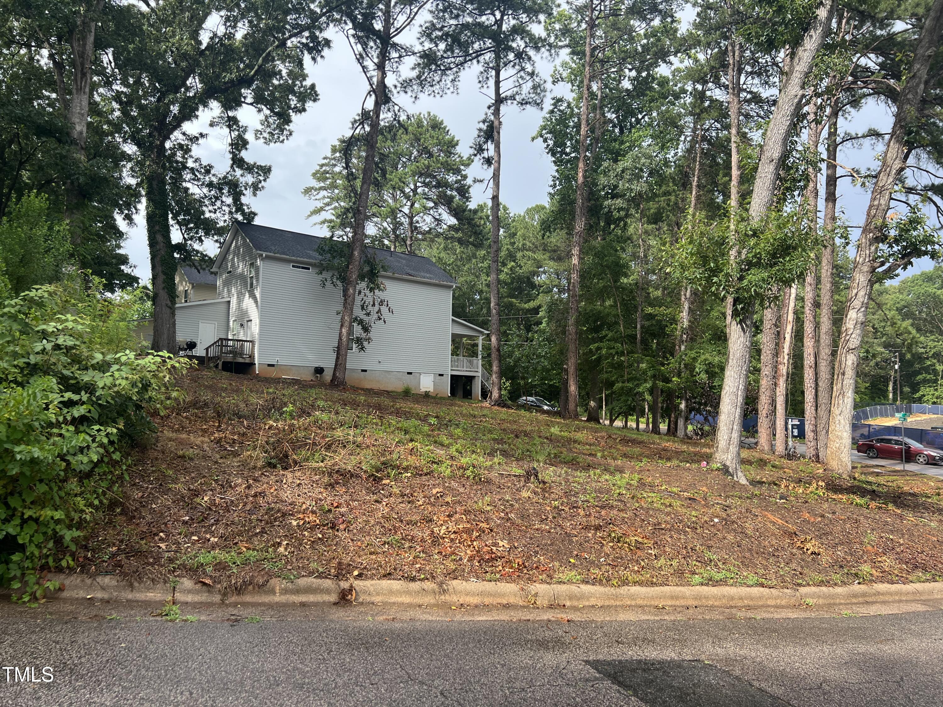 1334 Kent Road Raleigh, NC 27606 - Photo 3 of 4 a view of a house with a yard