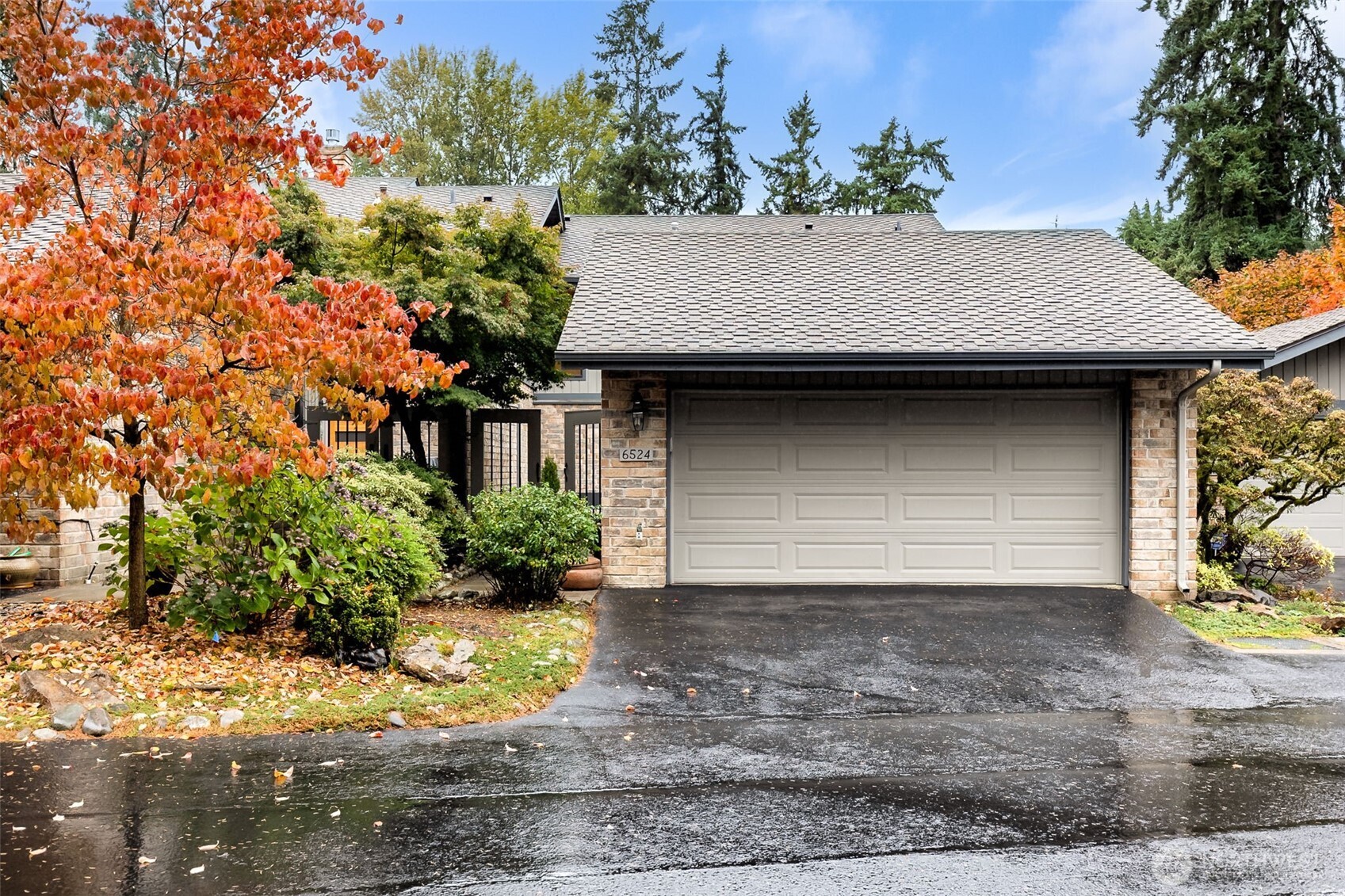 a view of a house with a yard and garage