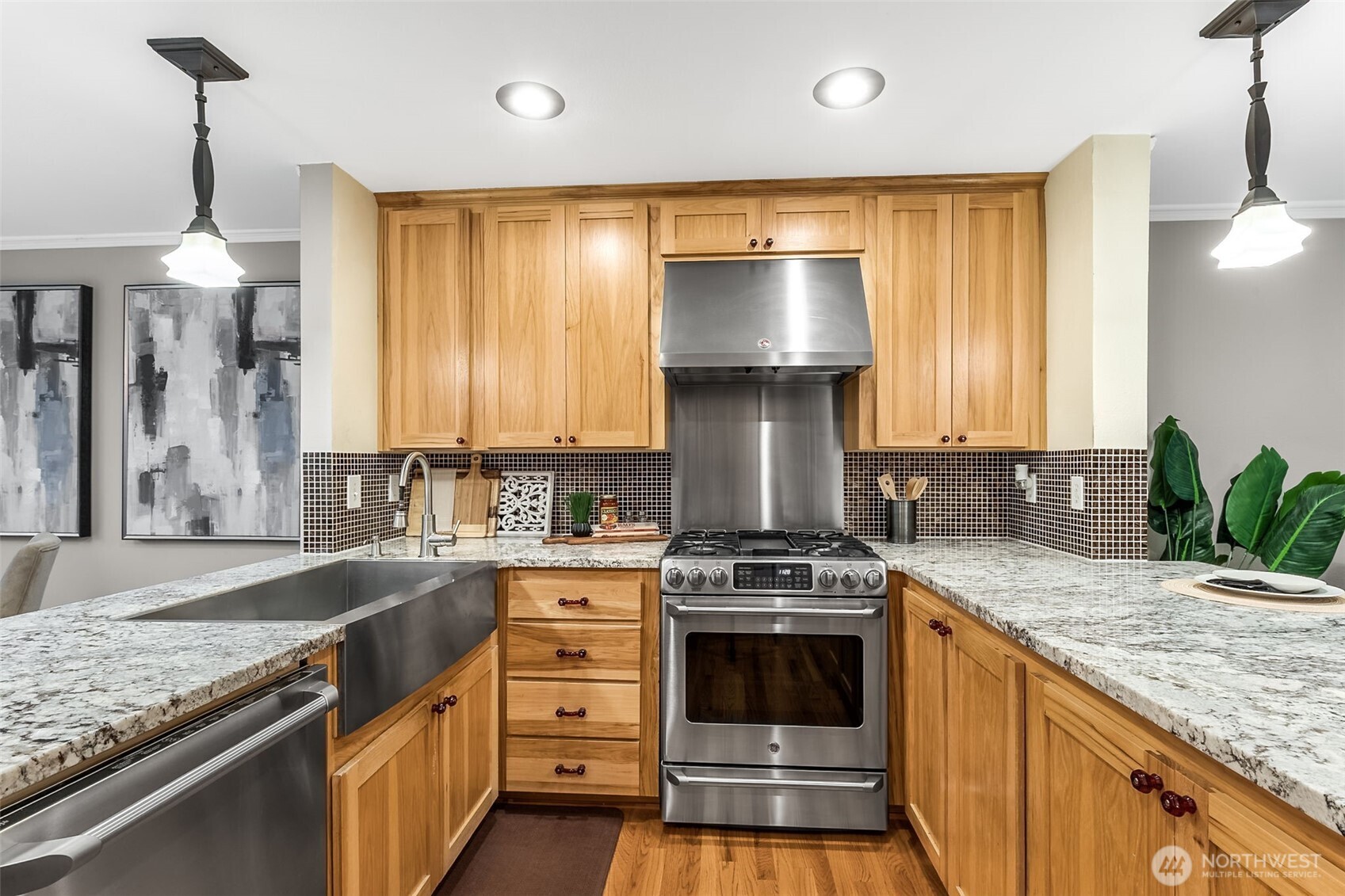 6524 Northeast 171st Place Kenmore, WA 98028 - Photo 14 of 35 a kitchen with granite countertop a sink stainless steel appliances and cabinets