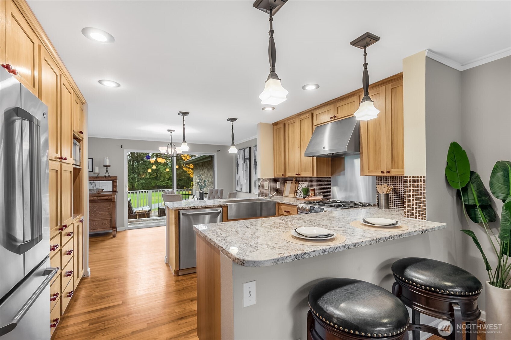6524 Northeast 171st Place Kenmore, WA 98028 - Photo 15 of 35 a kitchen with sink a stove and chairs