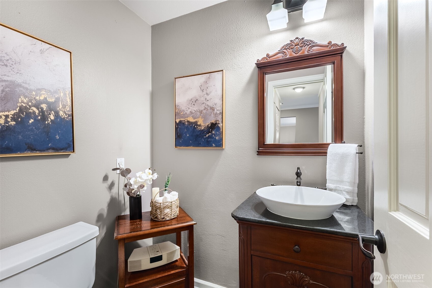 6524 Northeast 171st Place Kenmore, WA 98028 - Photo 20 of 35 a bathroom with a toilet sink and mirror