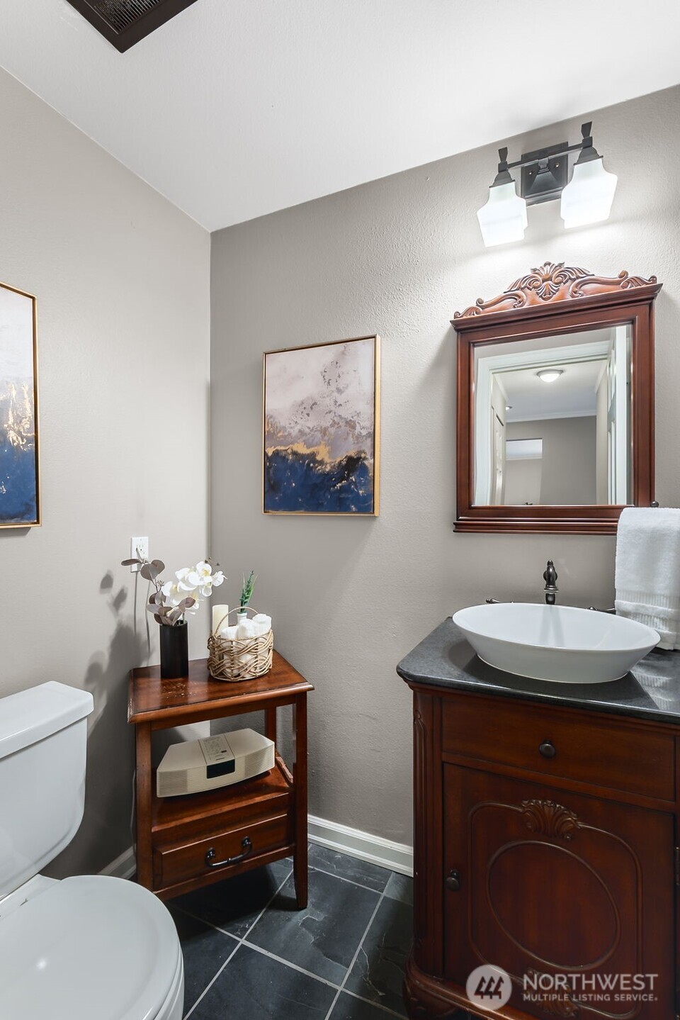 6524 Northeast 171st Place Kenmore, WA 98028 - Photo 21 of 35 a bathroom with a toilet a sink and mirror