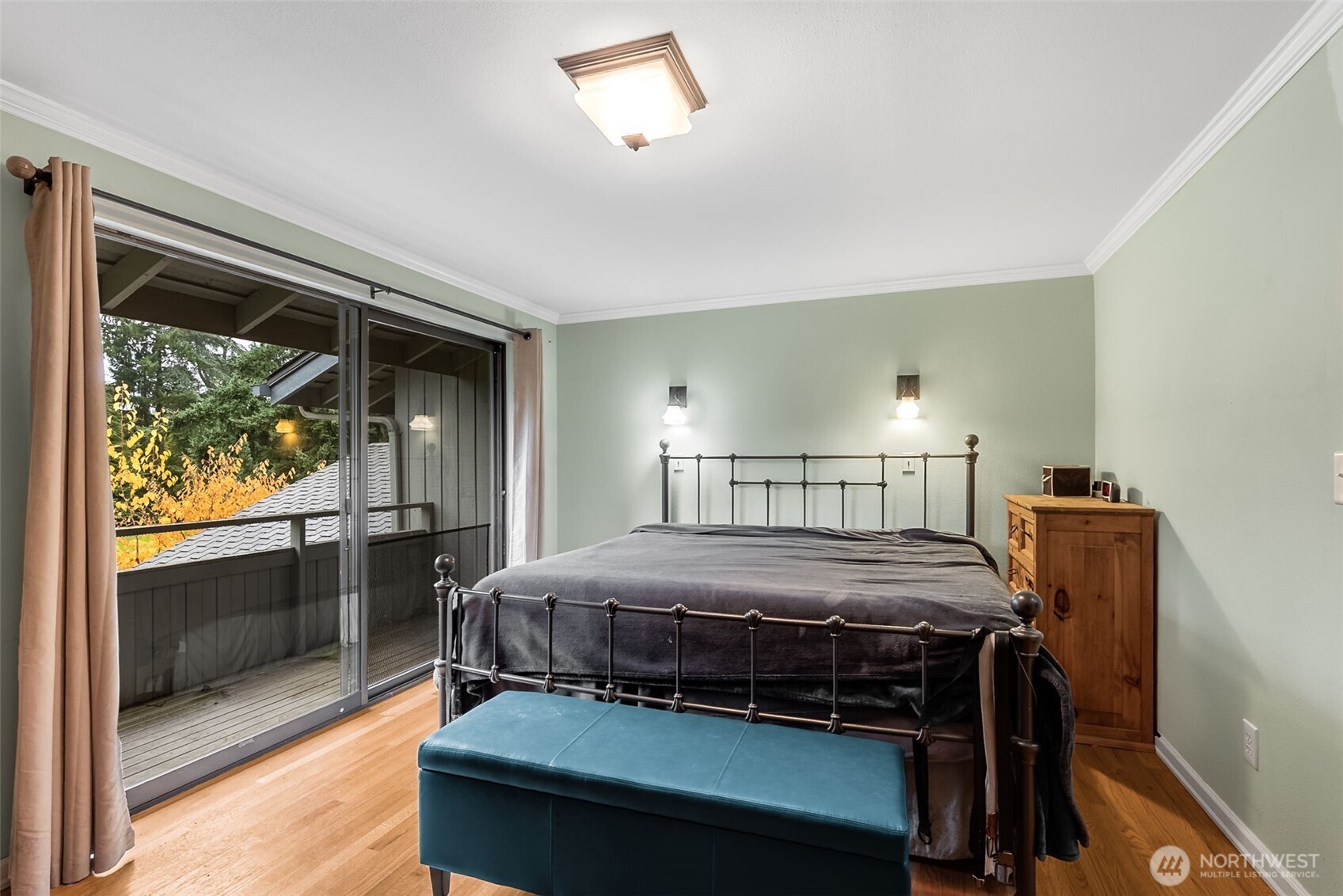 6524 Northeast 171st Place Kenmore, WA 98028 - Photo 22 of 35 a bedroom with a bed and a view of balcony