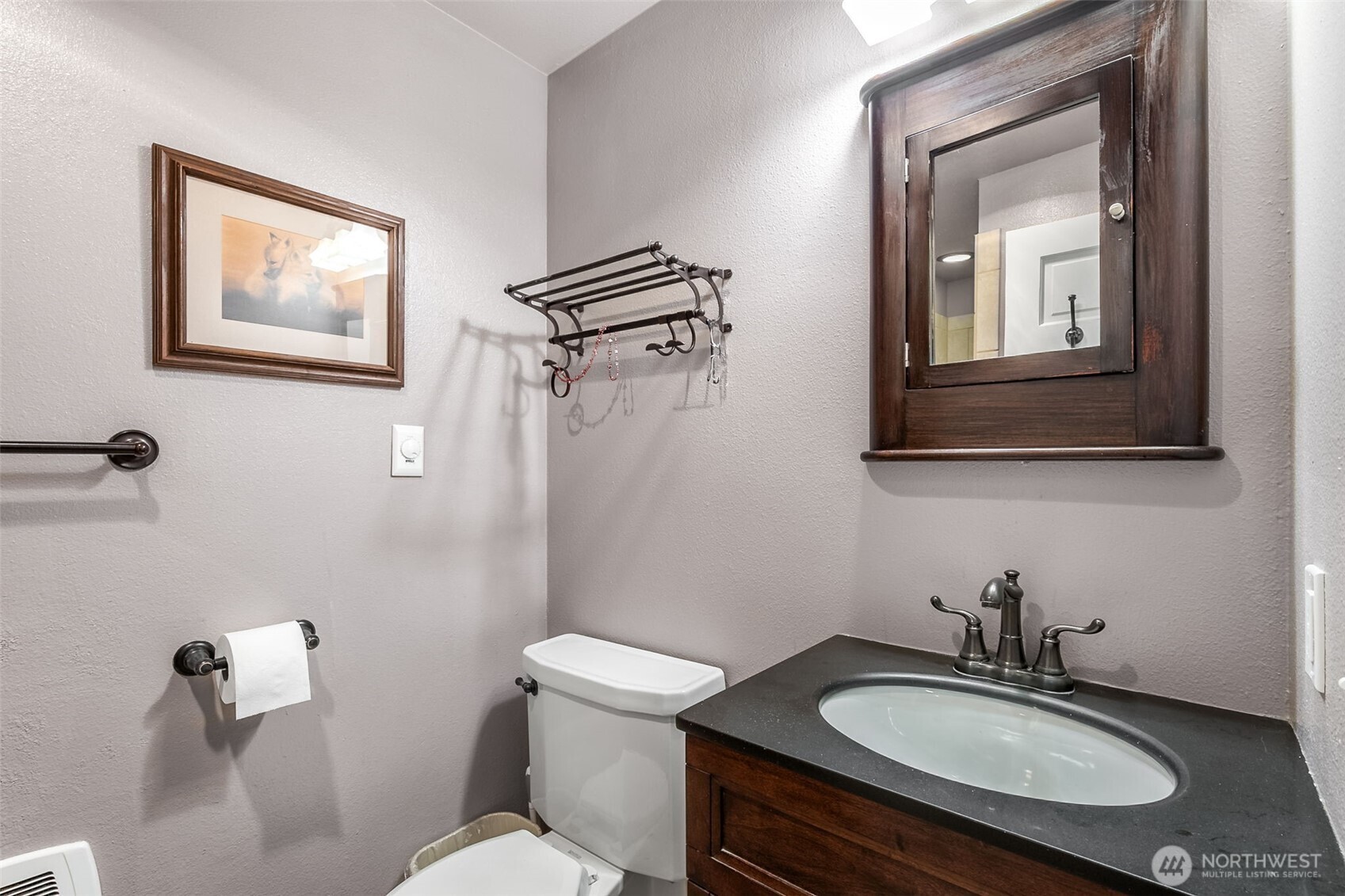 6524 Northeast 171st Place Kenmore, WA 98028 - Photo 23 of 35 a bathroom with a sink toilet and mirror