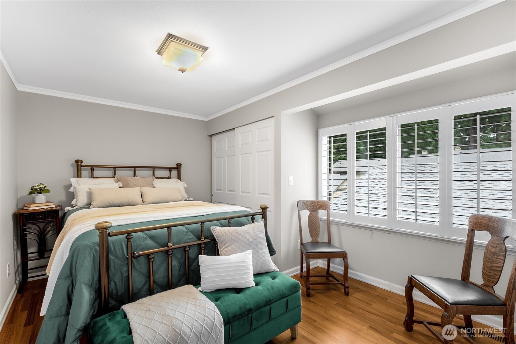 6524 Northeast 171st Place Kenmore, WA 98028 - Photo 25 of 35 a bedroom with a bed and a chair