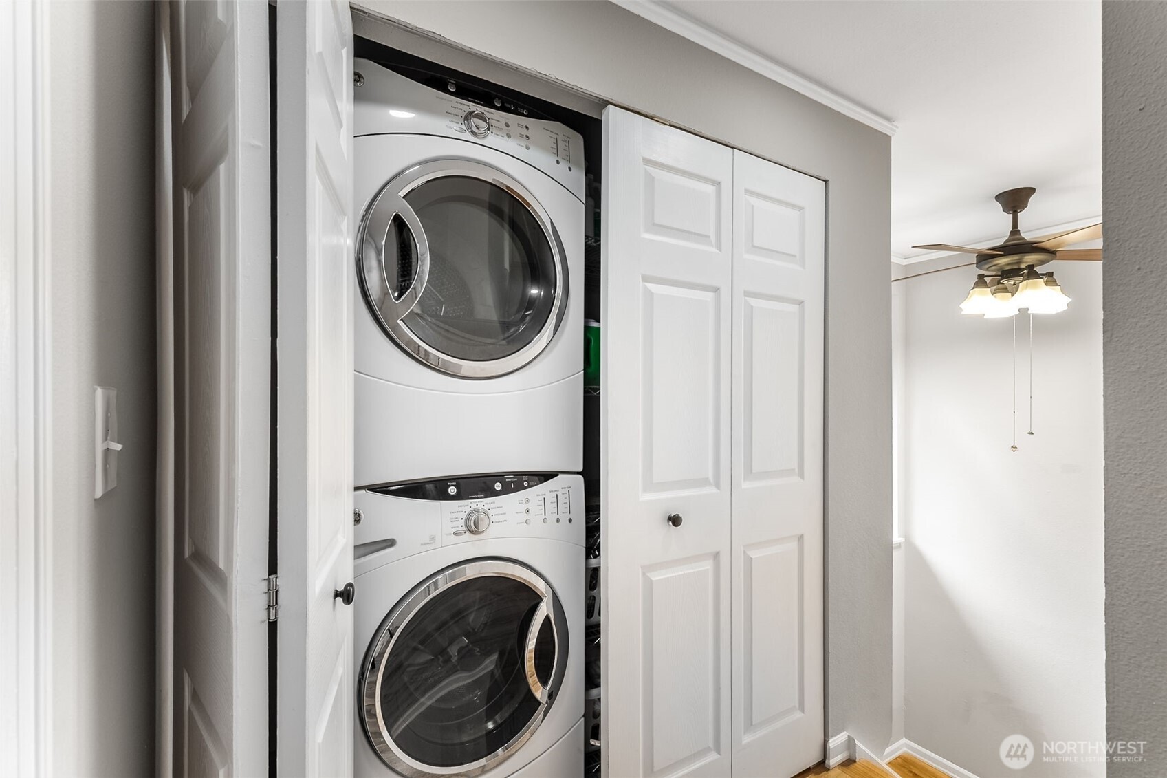 6524 Northeast 171st Place Kenmore, WA 98028 - Photo 29 of 35 a view of a hallway with washer and dryer