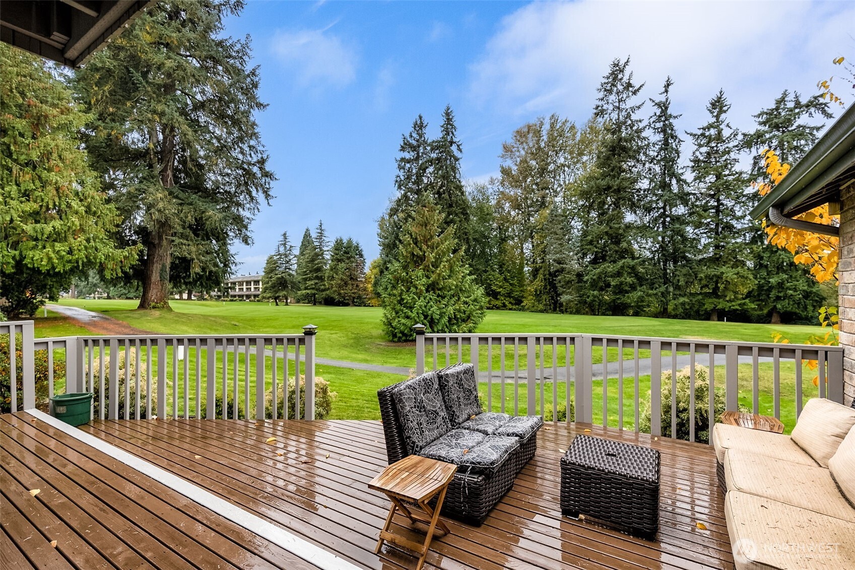 6524 Northeast 171st Place Kenmore, WA 98028 - Photo 31 of 35 a view of a deck with furniture and trees in the background