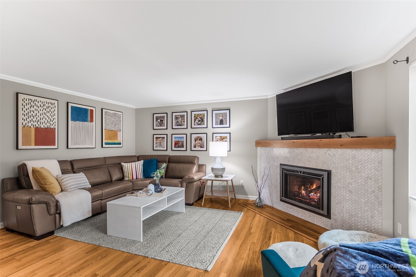 6524 Northeast 171st Place Kenmore, WA 98028 - Photo 6 of 35 a living room with furniture and a fireplace or television