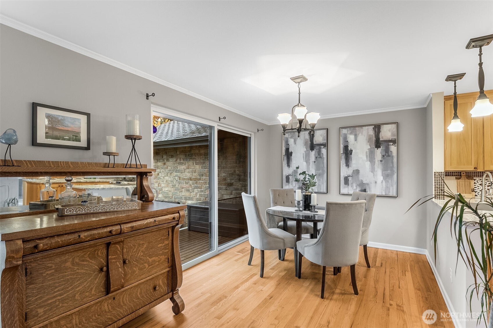 6524 Northeast 171st Place Kenmore, WA 98028 - Photo 9 of 35 a dining hall with furniture wooden floor and a chandelier