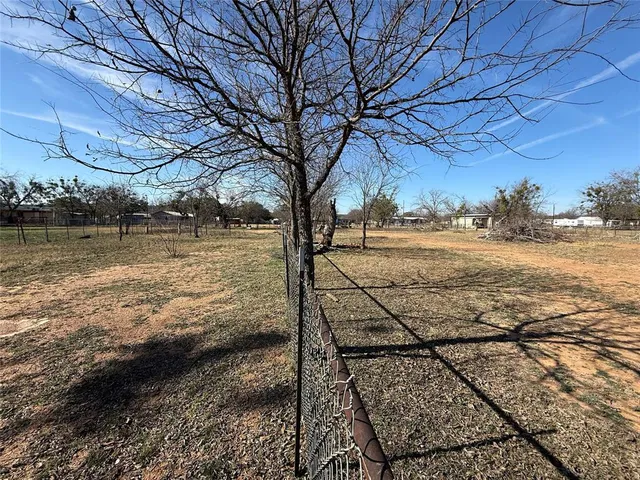 a view of a yard with an outdoor space