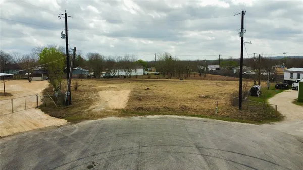 a view of a lake with a yard