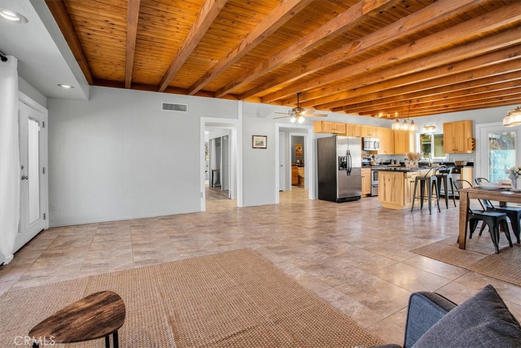 9384 Piedras Trail Morongo Valley, CA 92256 - Photo 12 of 75 a view of a livingroom with furniture and a projector