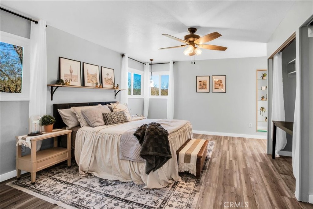 9384 Piedras Trail Morongo Valley, CA 92256 - Photo 20 of 75 a bedroom with a bed and wooden floor