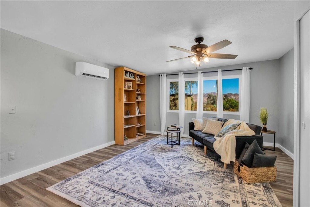 9384 Piedras Trail Morongo Valley, CA 92256 - Photo 25 of 75 a living room with furniture or window and a table
