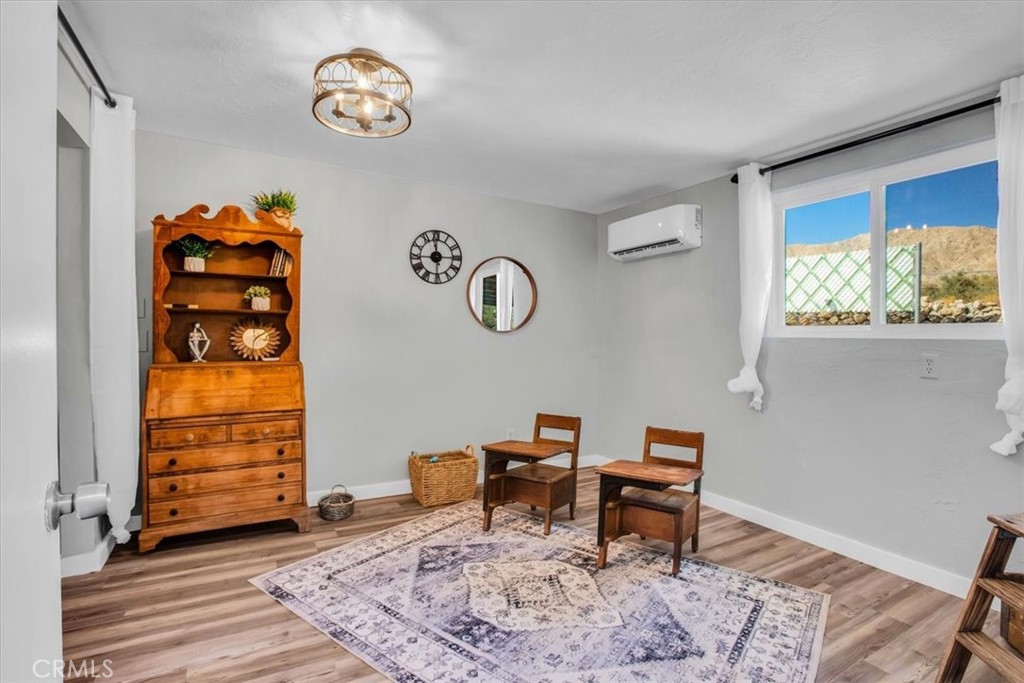 9384 Piedras Trail Morongo Valley, CA 92256 - Photo 26 of 75 a living room with furniture and a window