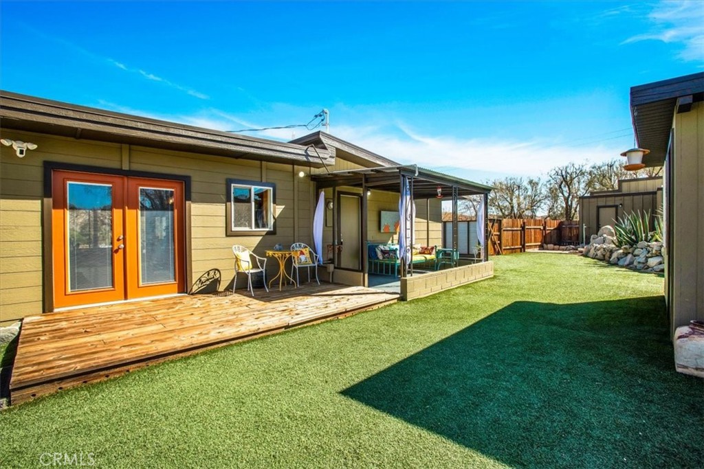 9384 Piedras Trail Morongo Valley, CA 92256 - Photo 30 of 75 a view of a house with swimming pool and porch