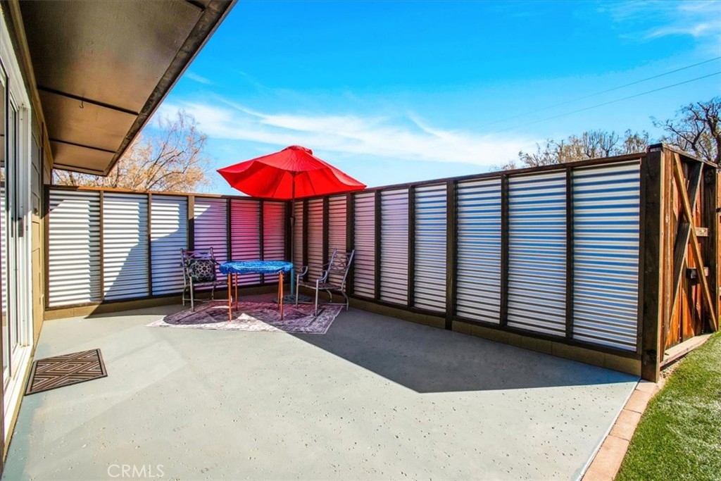 9384 Piedras Trail Morongo Valley, CA 92256 - Photo 35 of 75 an outdoor space with patio and wooden fence