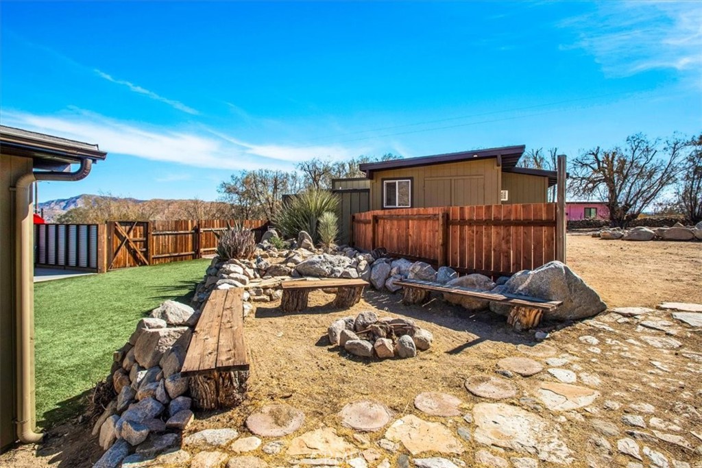 9384 Piedras Trail Morongo Valley, CA 92256 - Photo 37 of 75 a view of a chairs and tables in the patio
