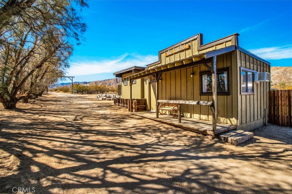 9384 Piedras Trail Morongo Valley, CA 92256 - Photo 39 of 75 a view of a house with a yard