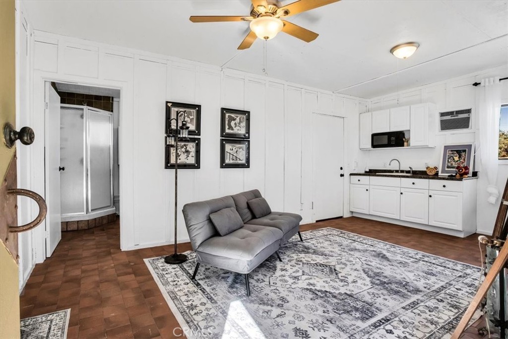 9384 Piedras Trail Morongo Valley, CA 92256 - Photo 41 of 75 a living room with furniture and a rug