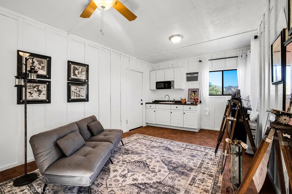 9384 Piedras Trail Morongo Valley, CA 92256 - Photo 42 of 75 a living room with furniture and view of kitchen
