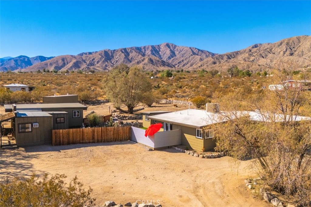 9384 Piedras Trail Morongo Valley, CA 92256 - Photo 65 of 75 a outdoor space with lots of buildings in the background