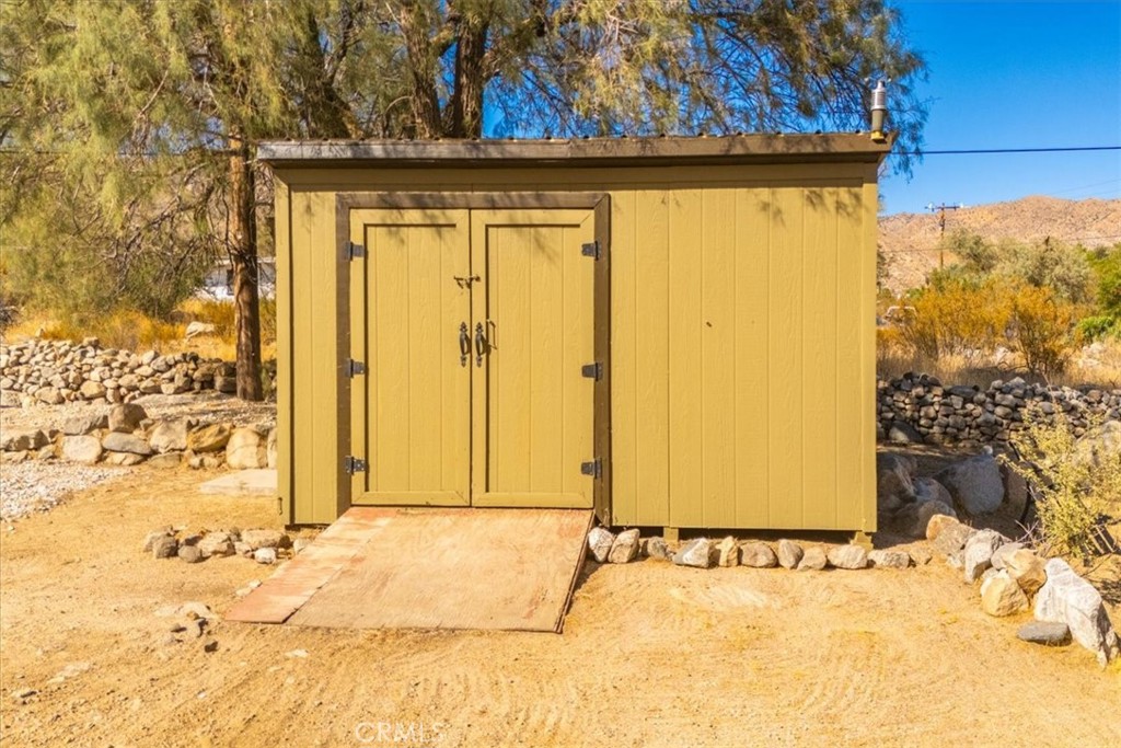 9384 Piedras Trail Morongo Valley, CA 92256 - Photo 66 of 75 a view of a door in the backyard of the house
