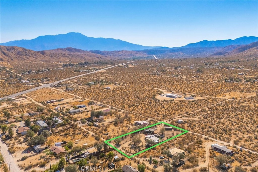 9384 Piedras Trail Morongo Valley, CA 92256 - Photo 69 of 75 a view of a house with a mountain