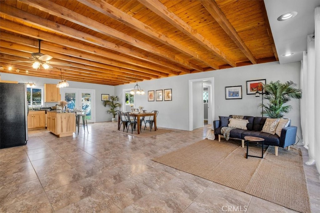 9384 Piedras Trail Morongo Valley, CA 92256 - Photo 9 of 75 a living room with furniture and view of kitchen