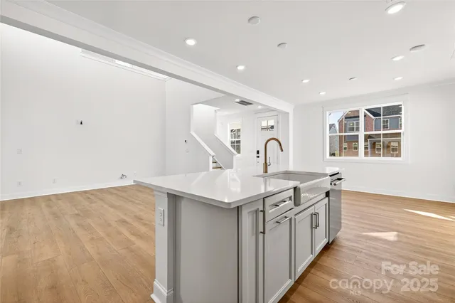 a kitchen with a sink and stove
