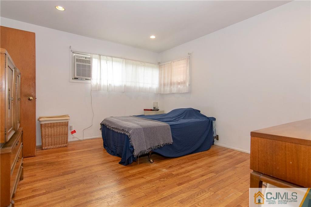 4 Harvard Road Old Bridge, NJ 08859 - Photo 7 of 18 a bedroom with a bed and a night stand