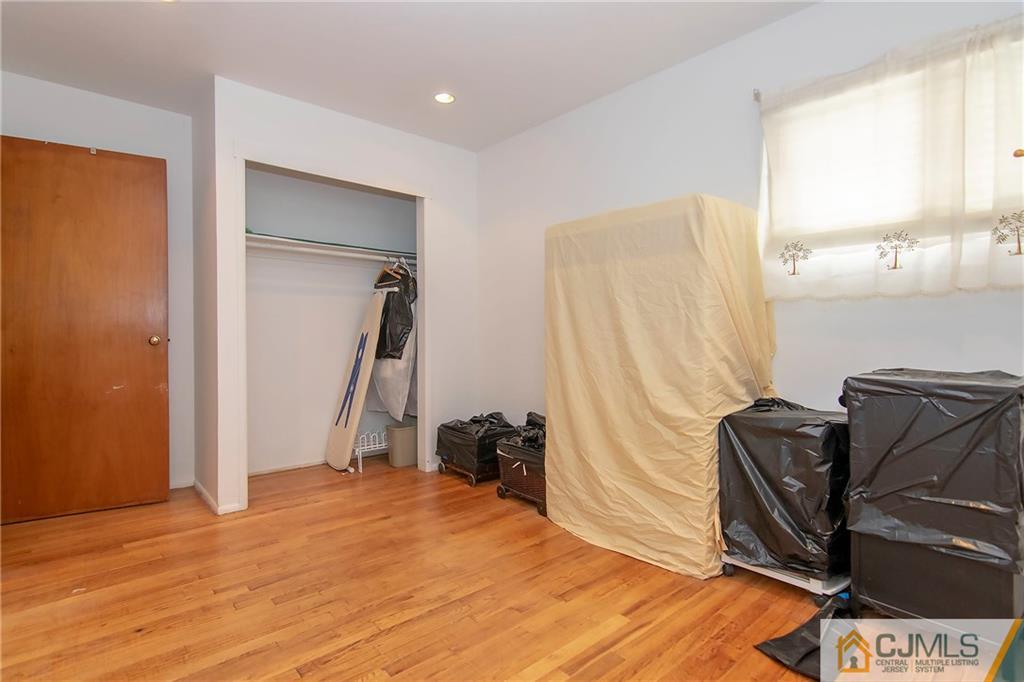 4 Harvard Road Old Bridge, NJ 08859 - Photo 8 of 18 a bed room with a bed and a window