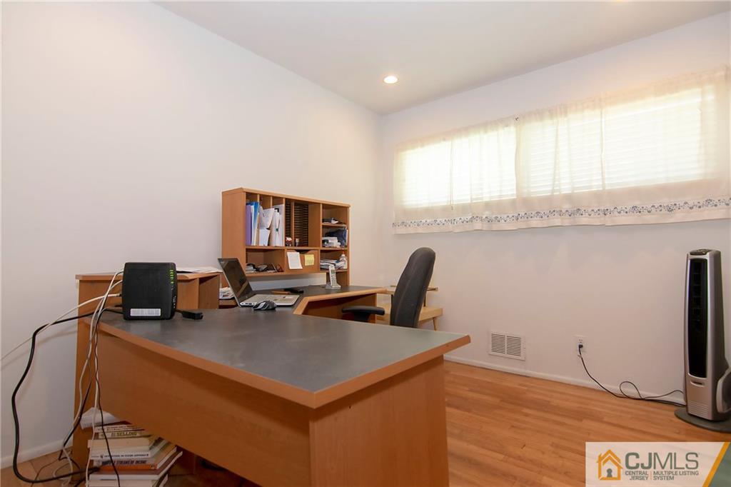 4 Harvard Road Old Bridge, NJ 08859 - Photo 9 of 18 a view of a workspace with furniture and a window
