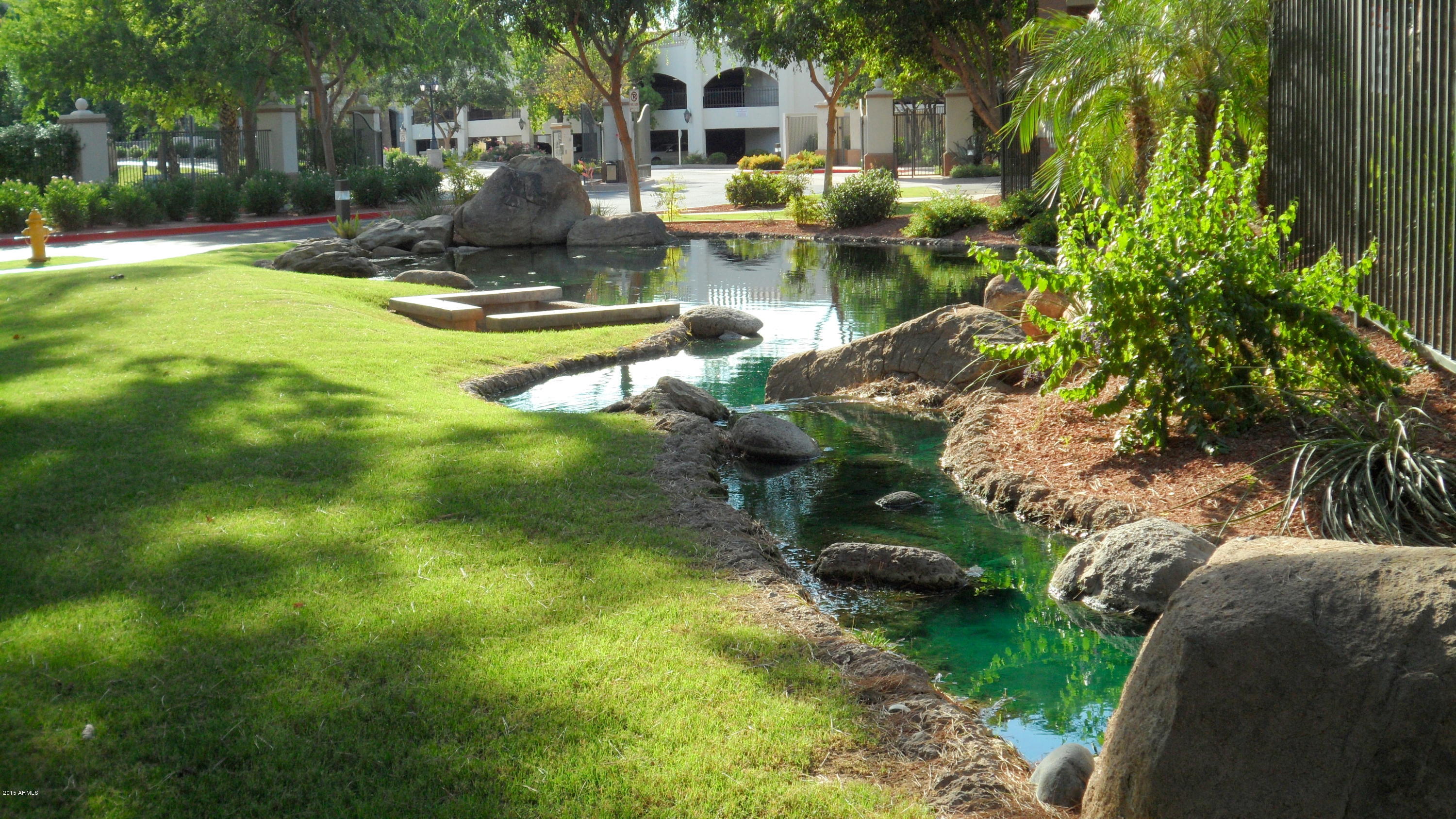 4488 East Thomas Road, Unit 1042 Phoenix, AZ 85018 - Photo 3 of 31 Lush Landscape and Koi Ponds