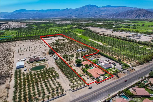 a view of an outdoor sitting area with wooden fence