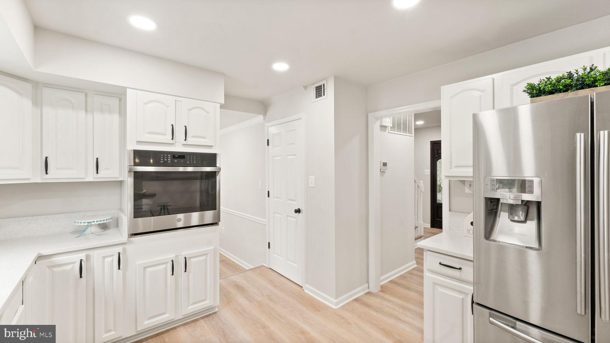 8309 Rolling Road Manassas, VA 20110 - Photo 28 of 70 a kitchen with stainless steel appliances a refrigerator and a stove top oven