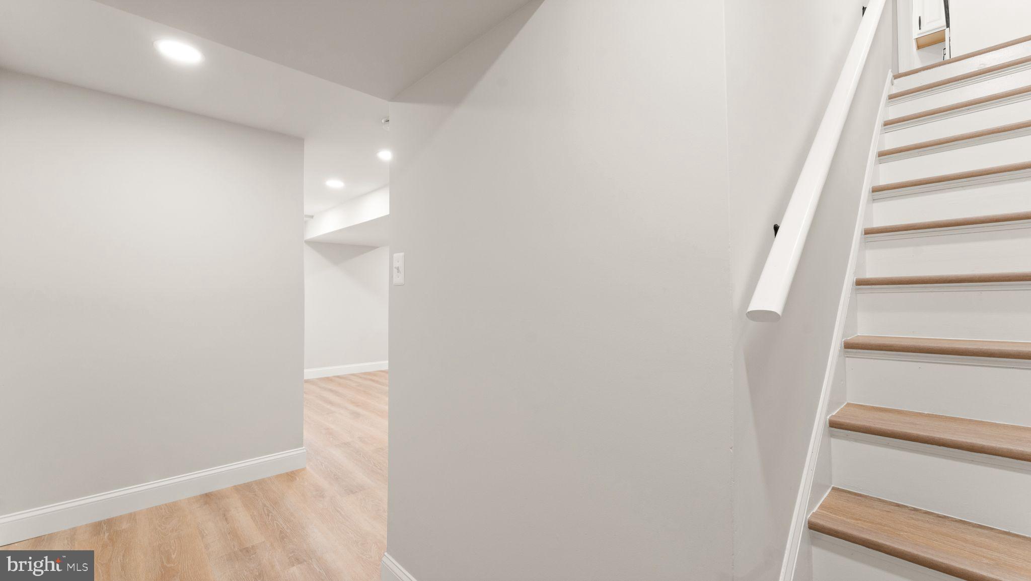 8309 Rolling Road Manassas, VA 20110 - Photo 52 of 70 a view of staircase with white walls and white door