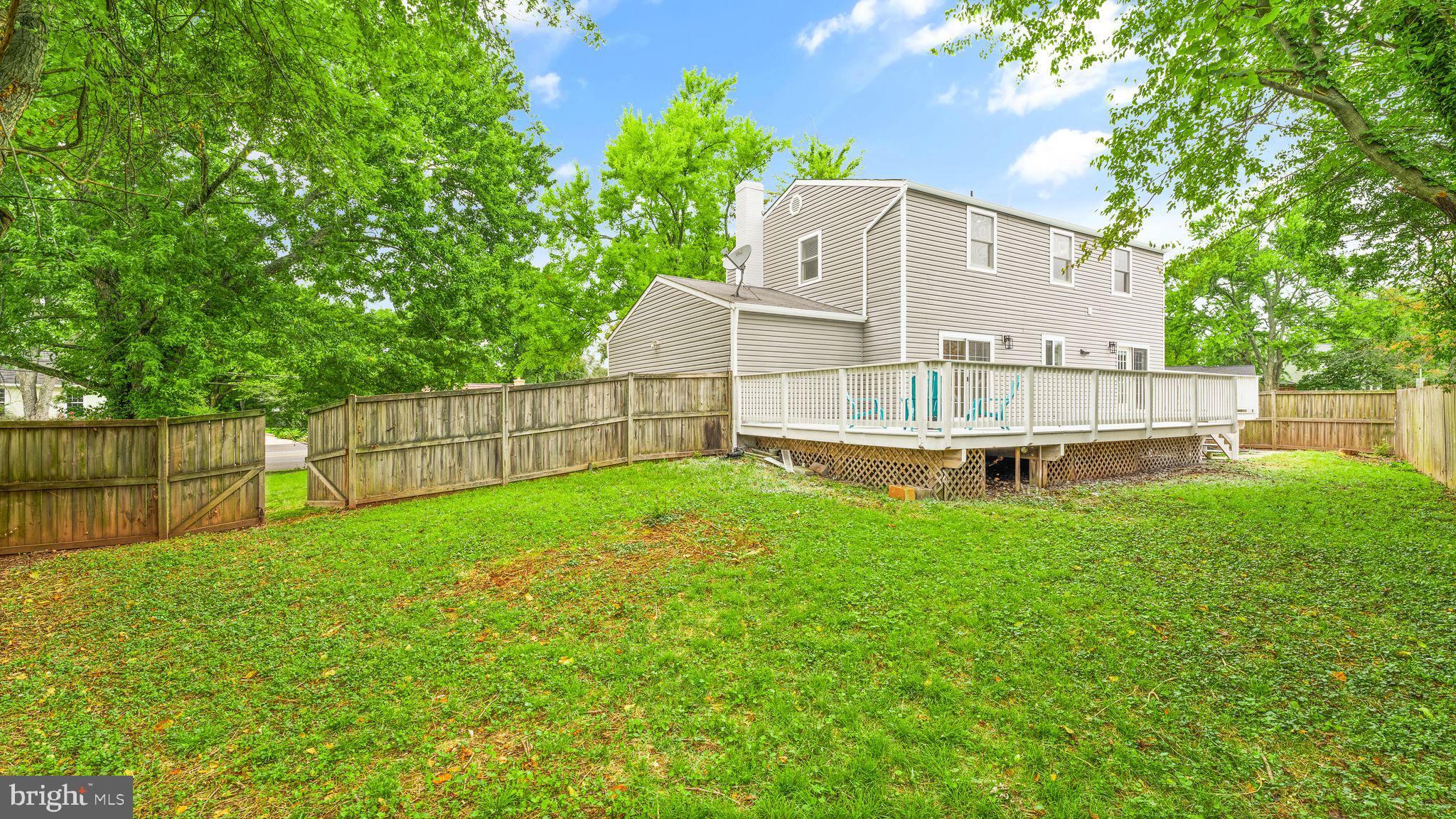8309 Rolling Road Manassas, VA 20110 - Photo 68 of 70 a view of a house with backyard and a garden