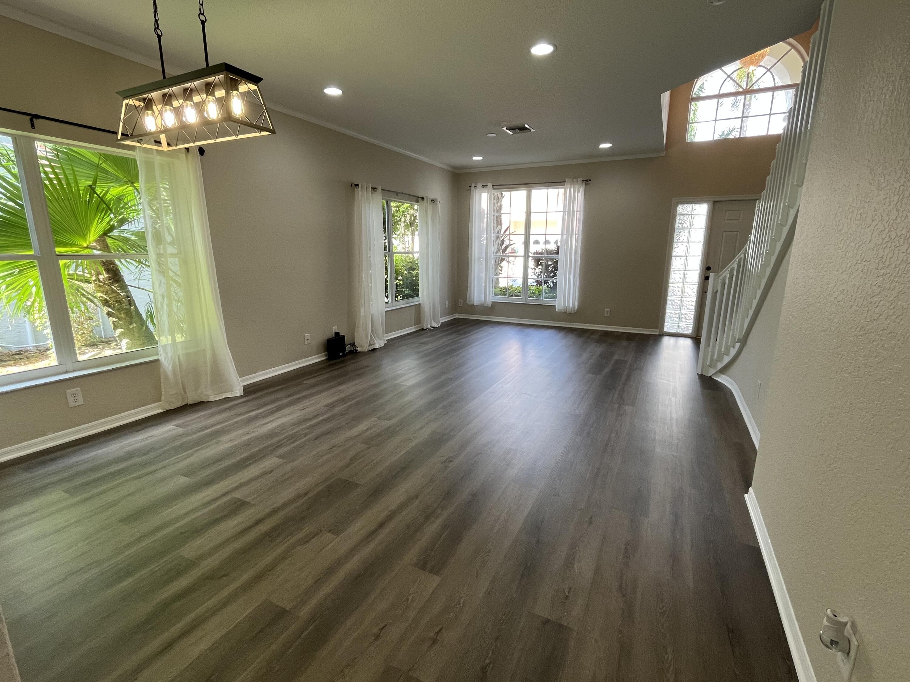 7299 Panache Way Boca Raton, FL 33433 - Photo 4 of 16 a view of livingroom with window wooden floor and front door